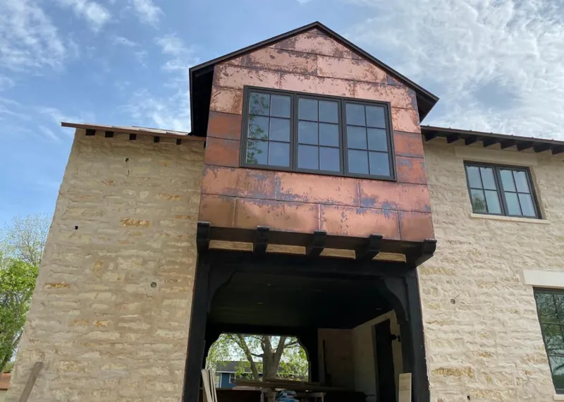 Copper metal panel facade on a stone building for Skylight Installation in Mauldin